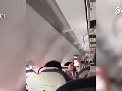 视频|川航备降客机内部画面：氧气面罩掉落