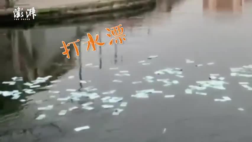 视频-米兰河面漂千张100欧元纸钞：市民不顾寒冬