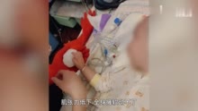 女子把雪人端到2岁患病女儿床前 ：她看下雪很认真，特地端来一盆