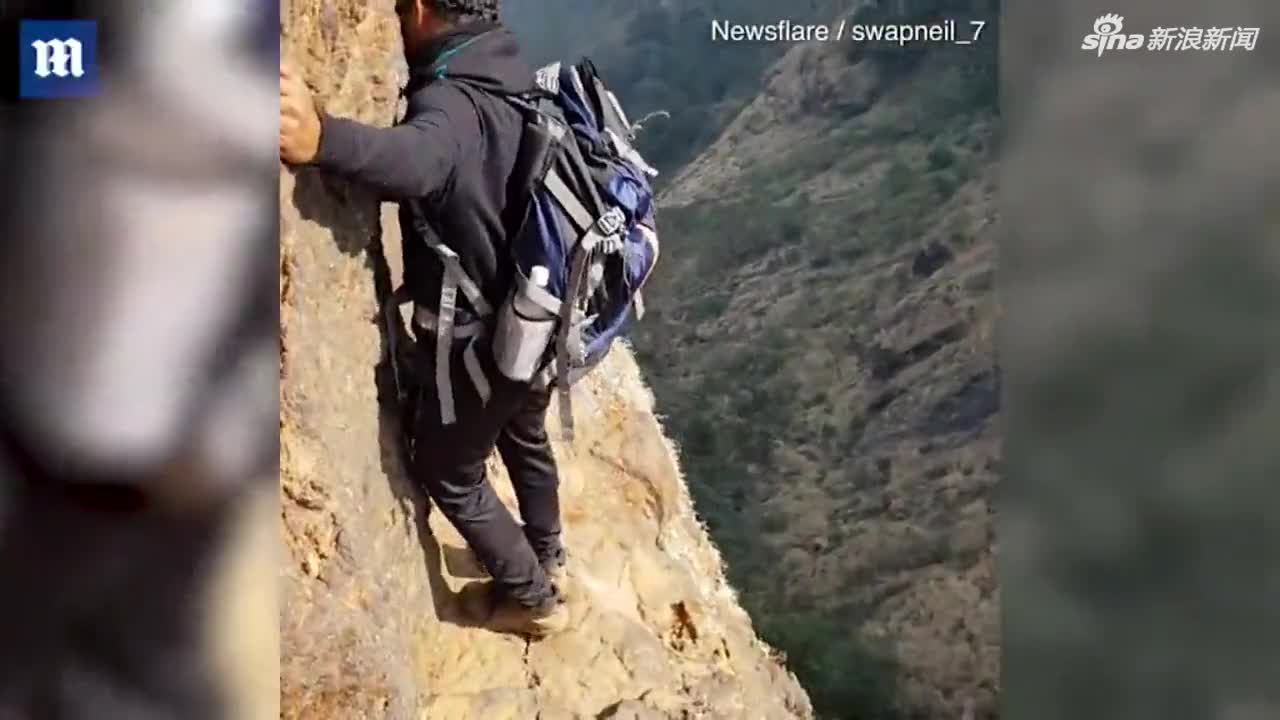 视频-印度一男子仅半米宽悬崖峭壁边徒步 未戴安全